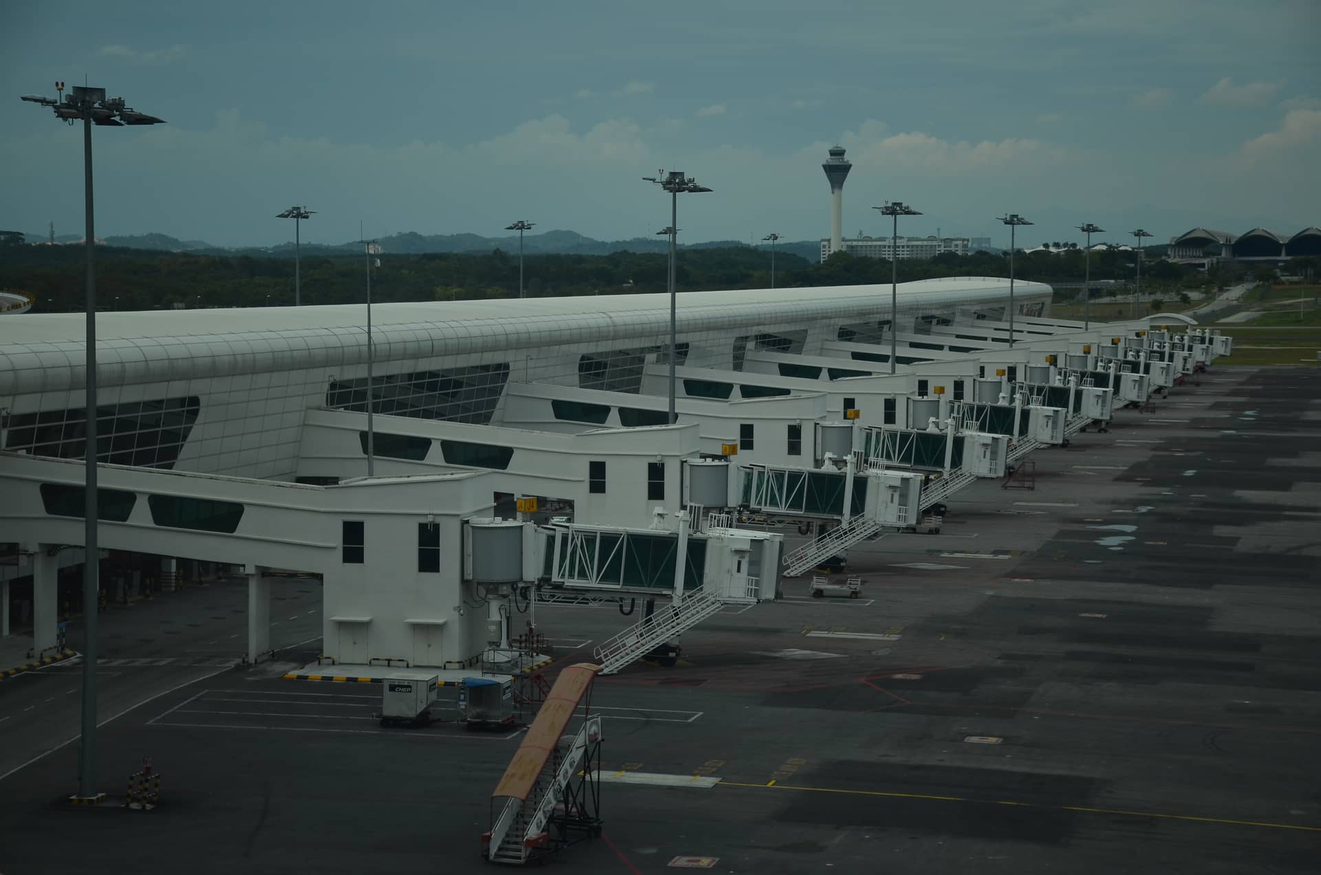 Empty terminal with many free gangways and airplane stands of kl – Malaysia, Asia. Photo: Christian Böhme