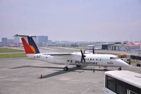 Nice little cute airplane bombardier dash of philippines on a sunny day