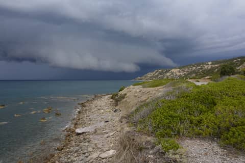 Rhodos thunderstorm clouds at the shore of greece island